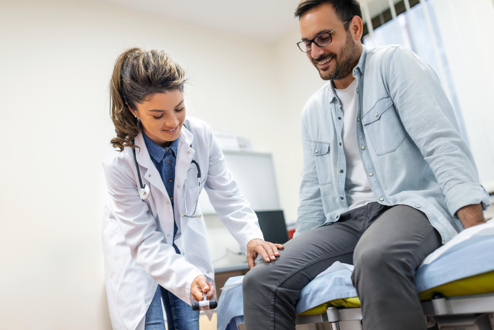 A primary care physician treating a patients knee